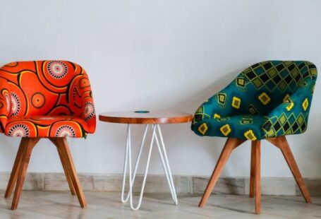 Furniture - Two Assorted-color Padded Chairs Near Side Table