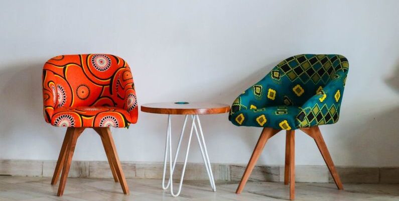 Furniture - Two Assorted-color Padded Chairs Near Side Table