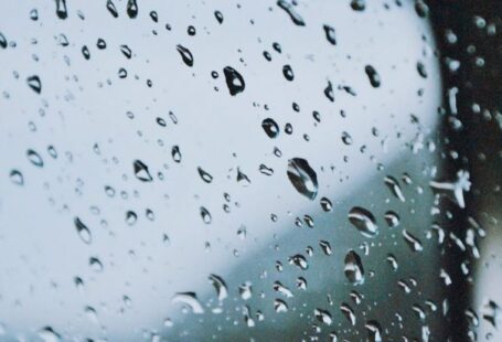 Glass-Balustrade - A car mirror with rain drops on it