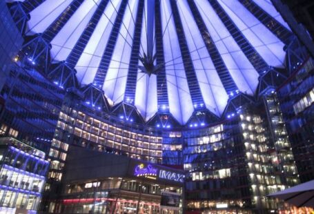 Modern Urban Aesthetic - Spectacular modern complex with illuminated glass roof at night