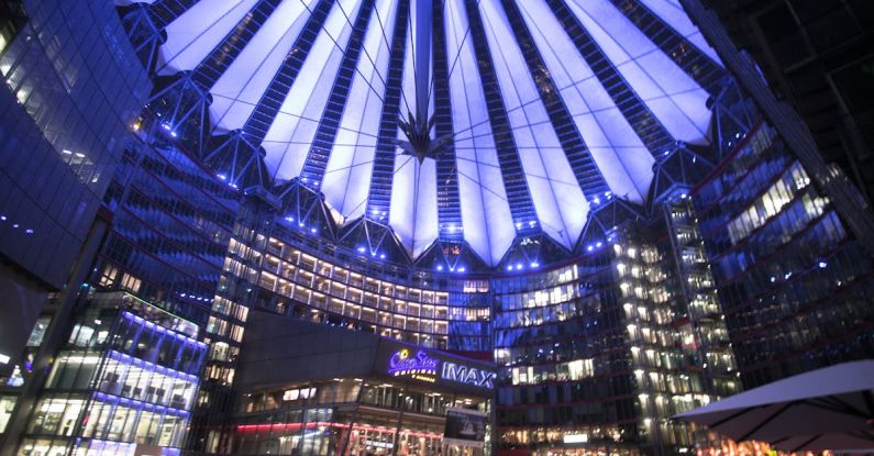 Modern Urban Aesthetic - Spectacular modern complex with illuminated glass roof at night
