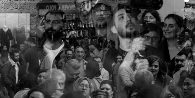 Double-Glazing Windows - A black and white photo of people in a crowd