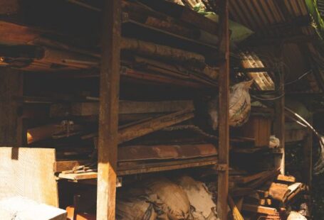 Multifunctional Storage - A small hut with a wood stove and a pile of wood