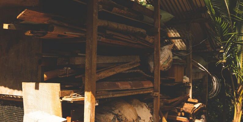 Multifunctional Storage - A small hut with a wood stove and a pile of wood