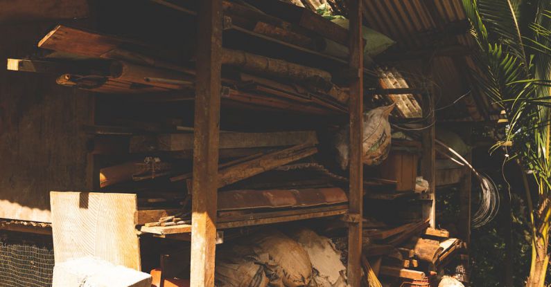 Multifunctional Storage - A small hut with a wood stove and a pile of wood