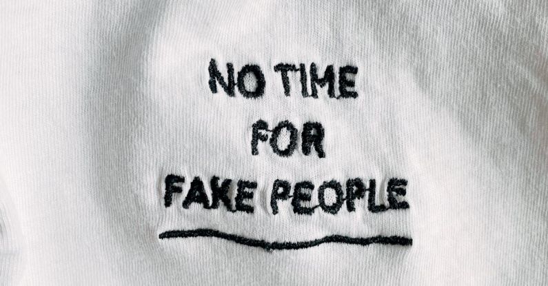 Vertical Design - White cotton cloth with inscription on black font