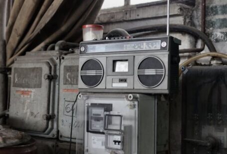 Storage System - Old fashioned cassette player placed in shabby garage near old industrial equipment
