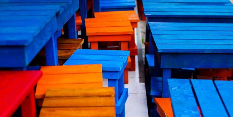 Multi-Purpose Furniture - Close-up of Colorful, Wooden Tables and Chairs