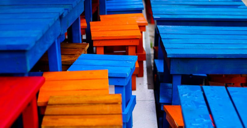 Multi-Purpose Furniture - Close-up of Colorful, Wooden Tables and Chairs