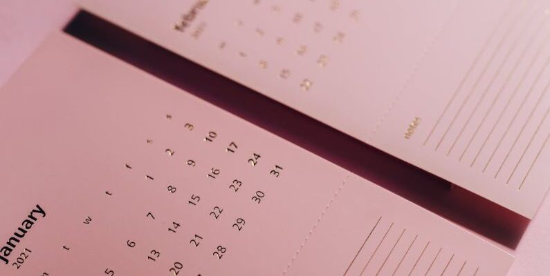 Color Of The Year - Calendar with inscriptions and numbers on office table