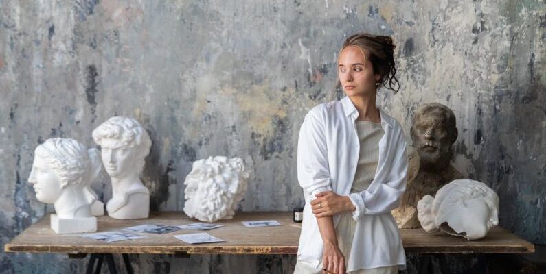 Textured Walls - Sculptor Posing in a Studio