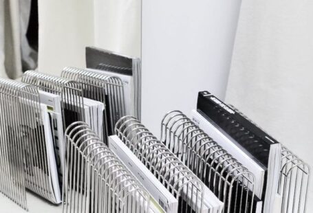 Smart Mirrors - Stand with magazines on floor near mirror