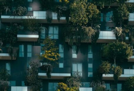 Balcony Design - Modern residential building facade decorated with green plants