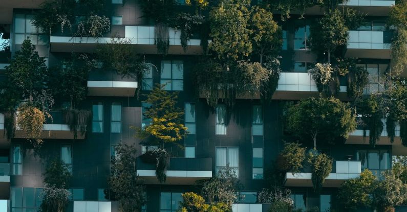 Balcony Design - Modern residential building facade decorated with green plants