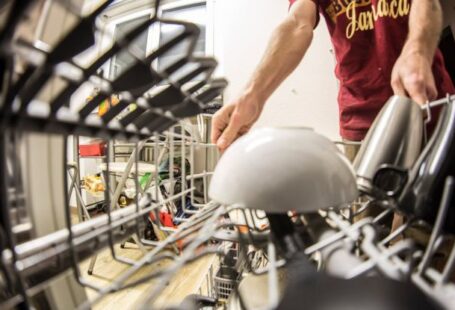 Dishwasher - Fish-eye Photography of Man Pulling the Dishwasher Rack