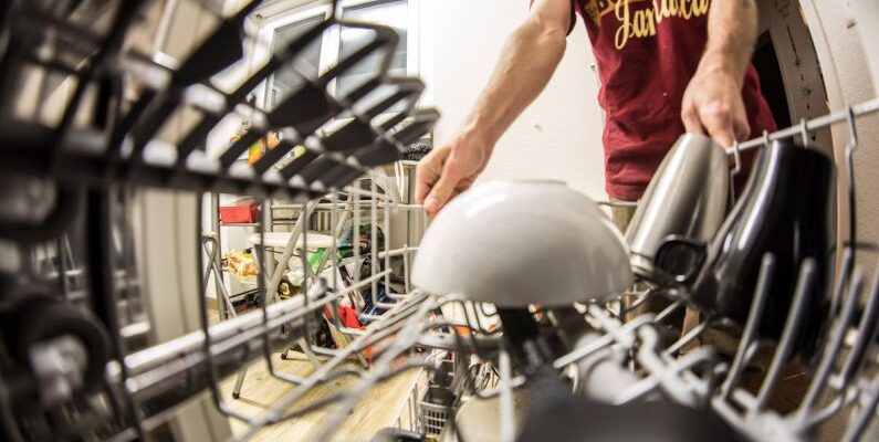 Dishwasher - Fish-eye Photography of Man Pulling the Dishwasher Rack