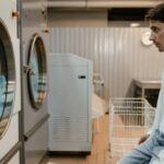 Smart Washing Machines - Man Looking at Washing Machines