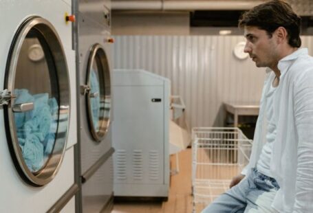 Smart Washing Machines - Man Looking at Washing Machines