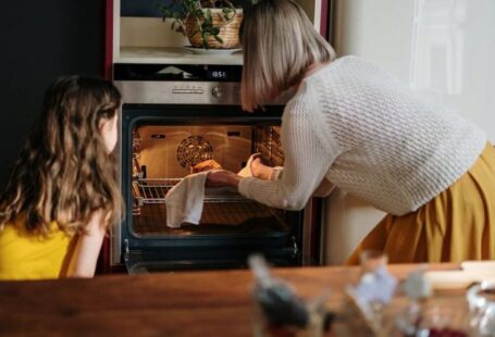 Oven - Woman in White Sweater Baking Cake