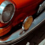 Compact Cookware - A red car parked on a brick walkway