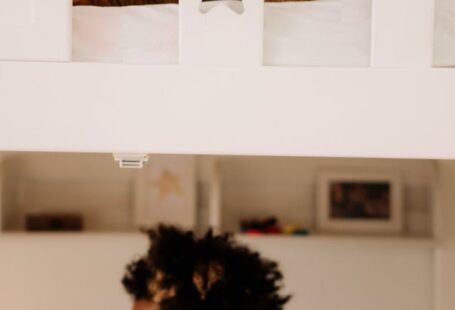 Loft Bed - A Boy Sitting Under the Bed