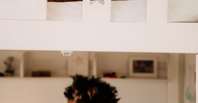 Loft Bed - A Boy Sitting Under the Bed