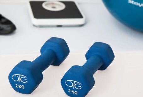 Home Gym - Two 2 Kg. Blue Hex Dumbbells on White Surface