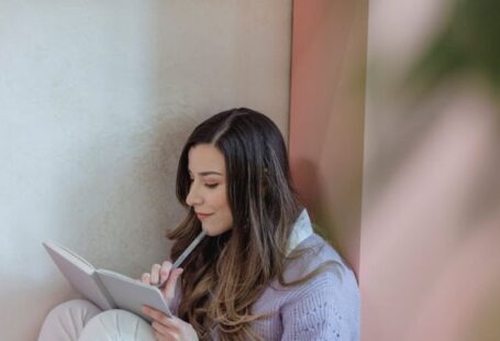Task Lighting - Focused woman writing in notebook