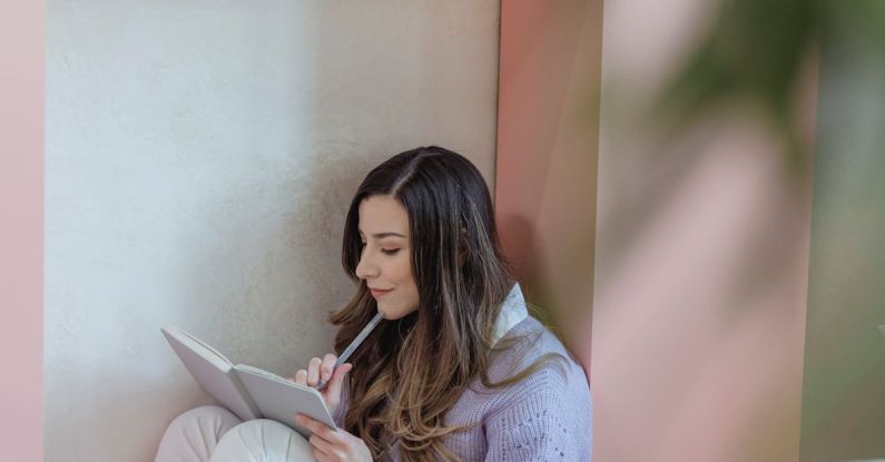 Task Lighting - Focused woman writing in notebook