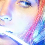 LED Strip Lighting - Woman With Colorful Hair with LED Strip Light in the Mouth