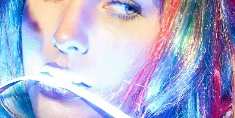 LED Strip Lighting - Woman With Colorful Hair with LED Strip Light in the Mouth