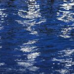Light Reflective Surfaces - A reflection of a boat in the water
