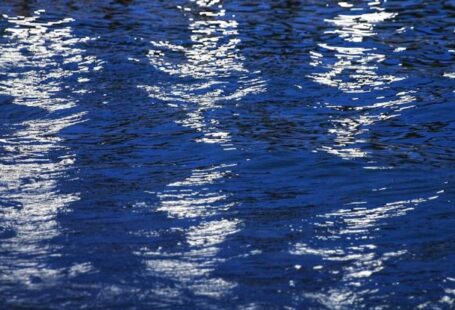 Light Reflective Surfaces - A reflection of a boat in the water