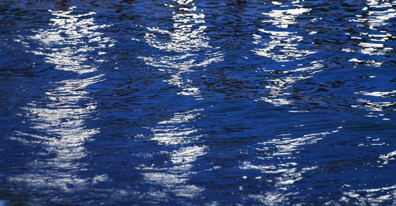 Light Reflective Surfaces - A reflection of a boat in the water