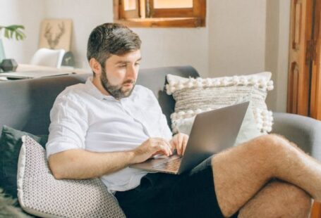 Home Office - A Man Using a Laptop